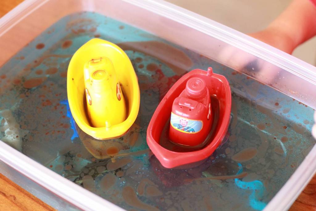 child working on ocean pollution science fair projects