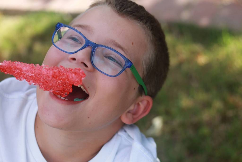 child enjoying finished rock candy experiment
