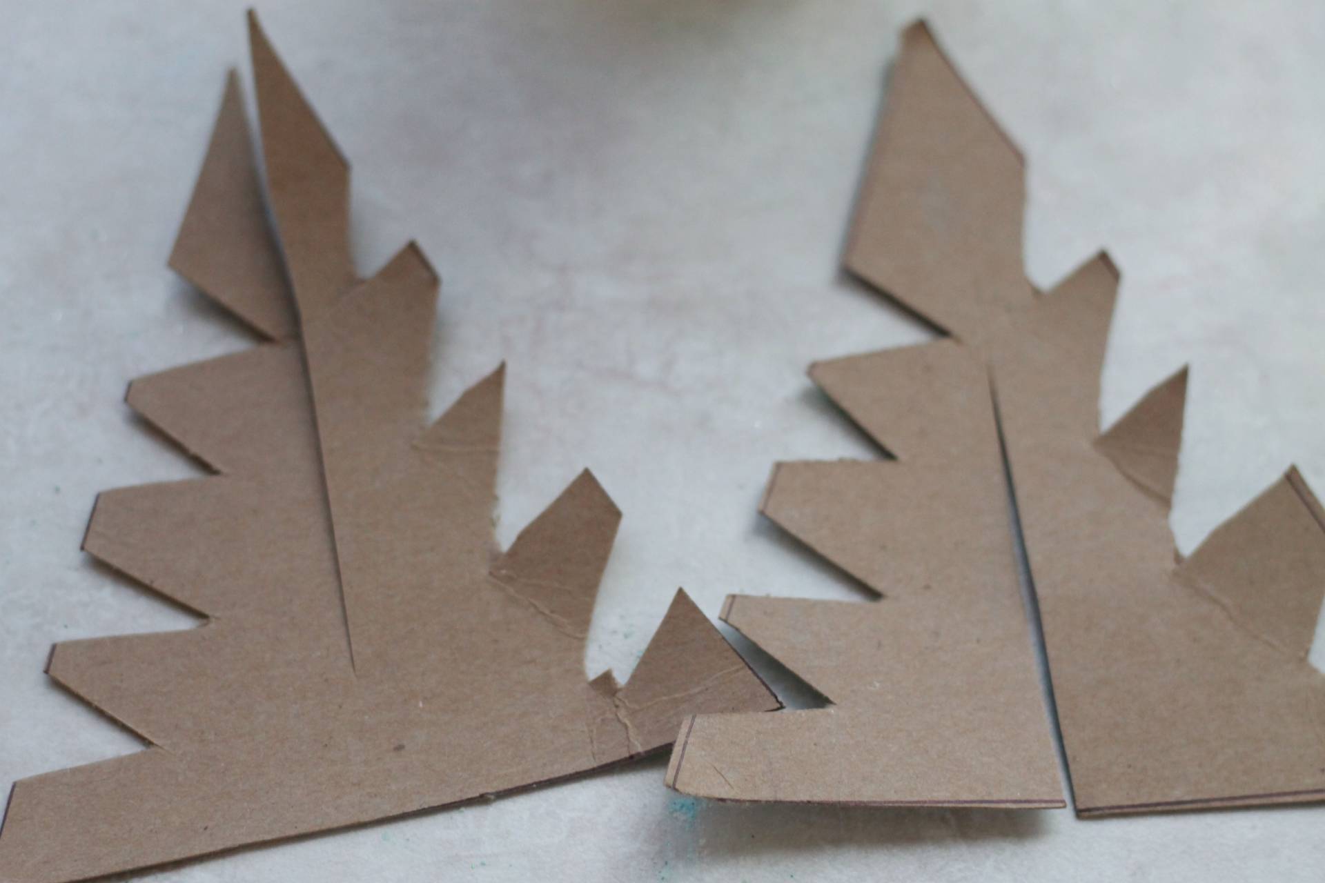 cutting out cardboard christmas trees