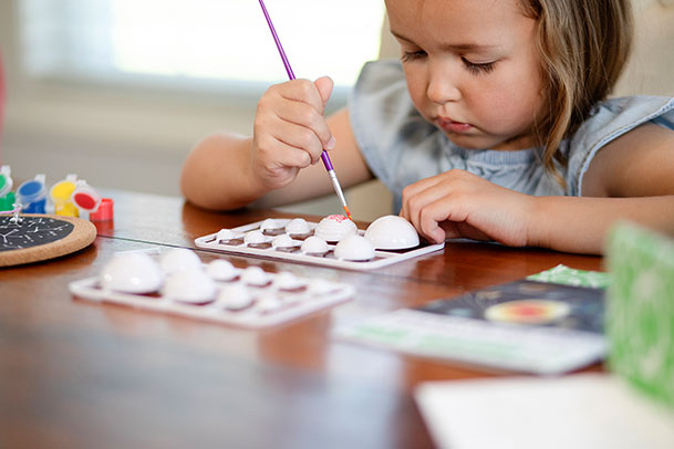 child playing paint and craft kits