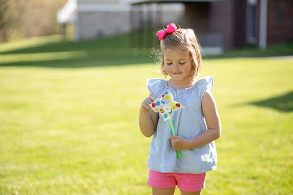 kid happily playing from craft subscription box
